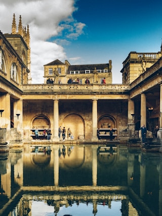 a large building with a pool in the middle of it