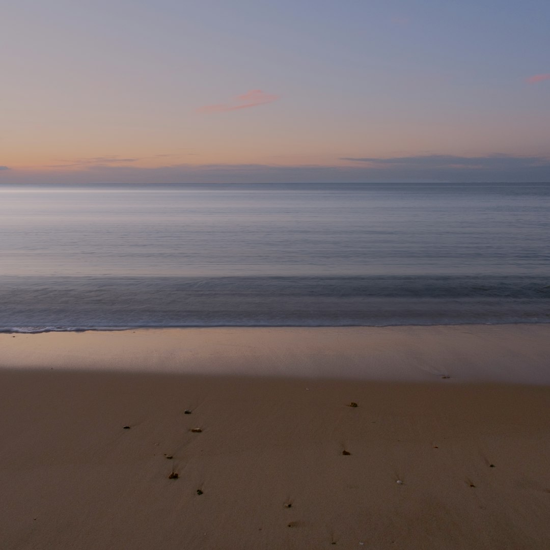 body of water during sunset