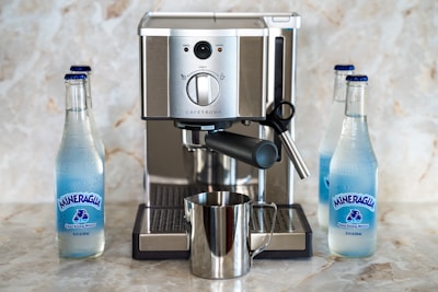Close-up of the sleek Japanese Enagic machine producing fresh Kangen Water in a modern kitchen setting.