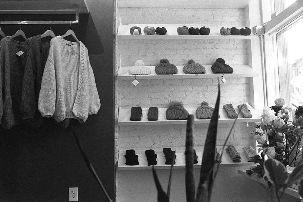 a black and white photo of a clothing store