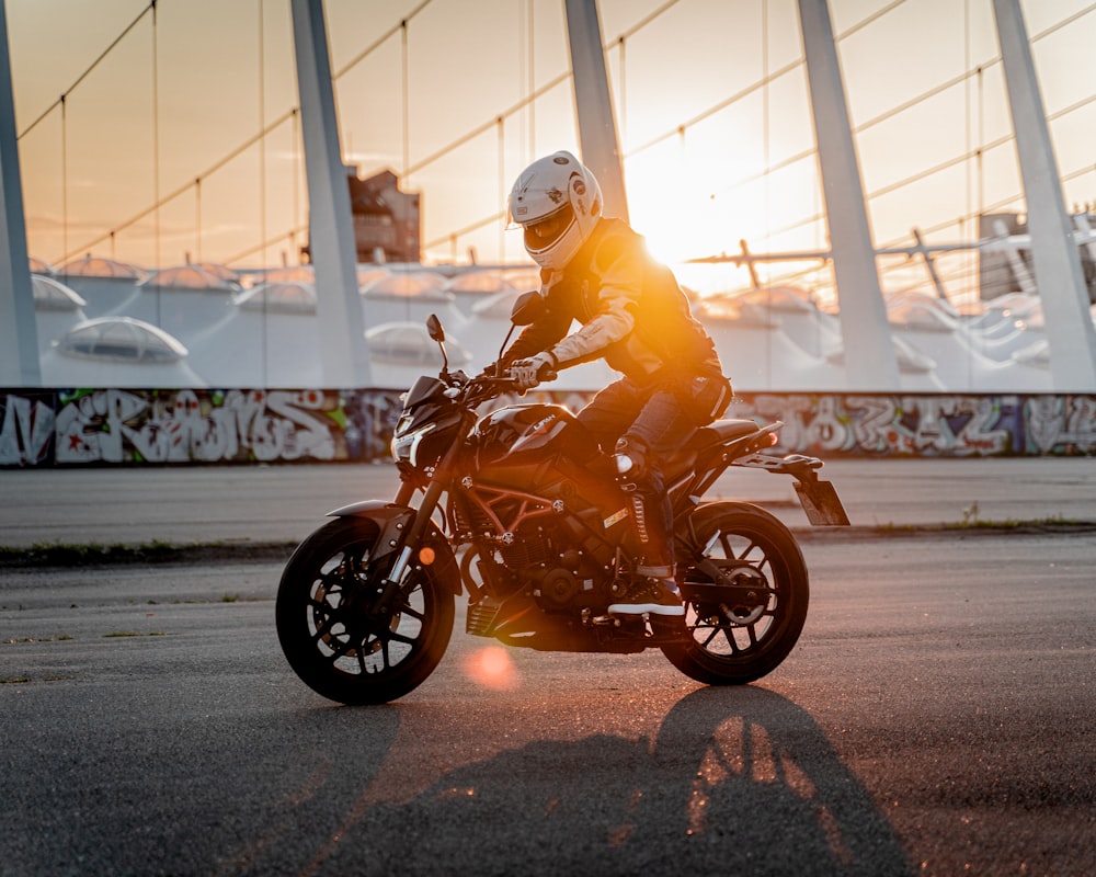 a person riding a motorcycle on a city street