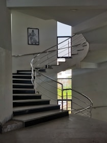 A designer sketch of a modern metal staircase on a drafting table.