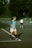 a man standing on a tennis court holding a racquet