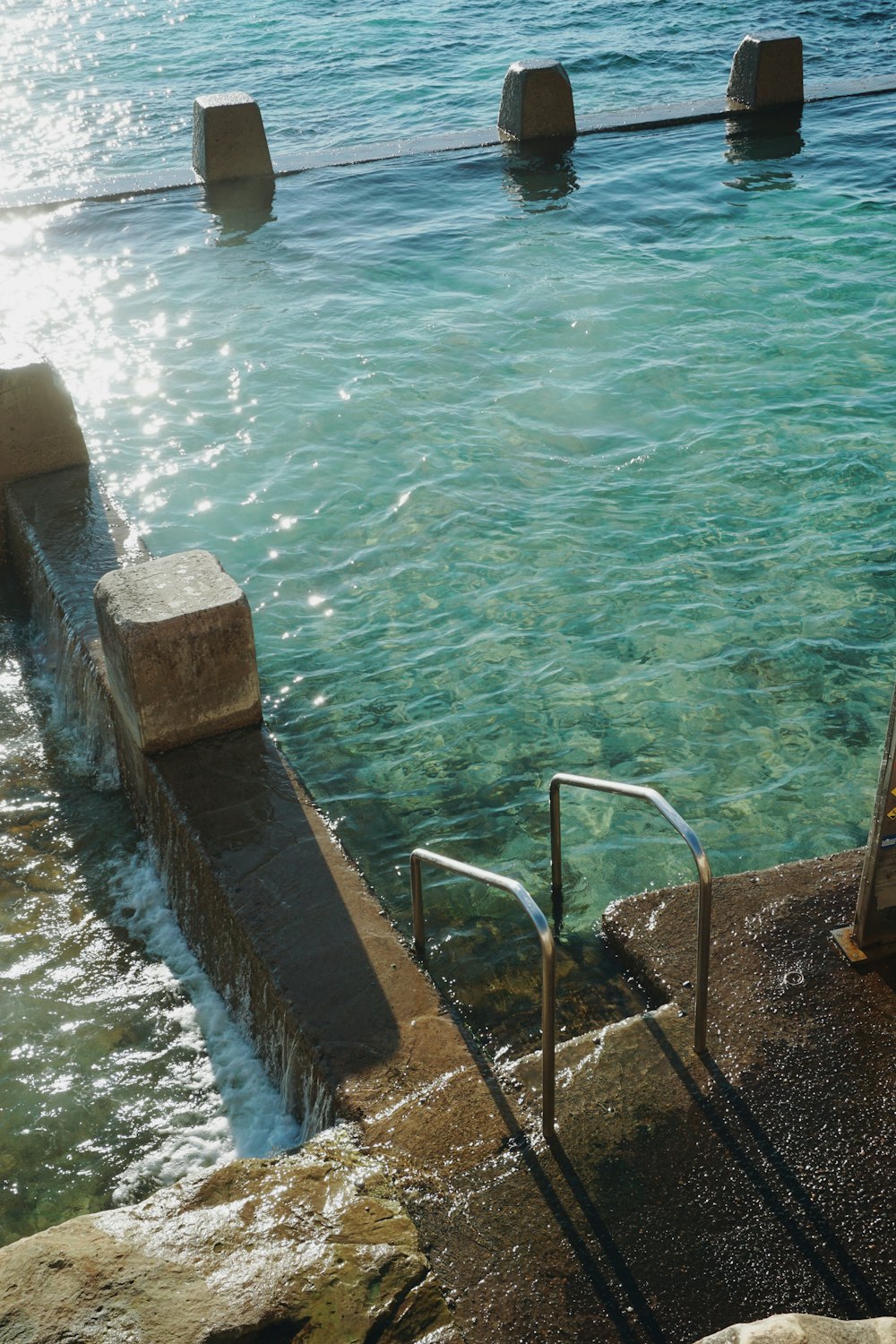 a couple of steps that are next to a body of water