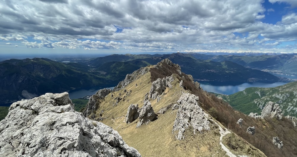 a view of a mountain range with a lake in the distance