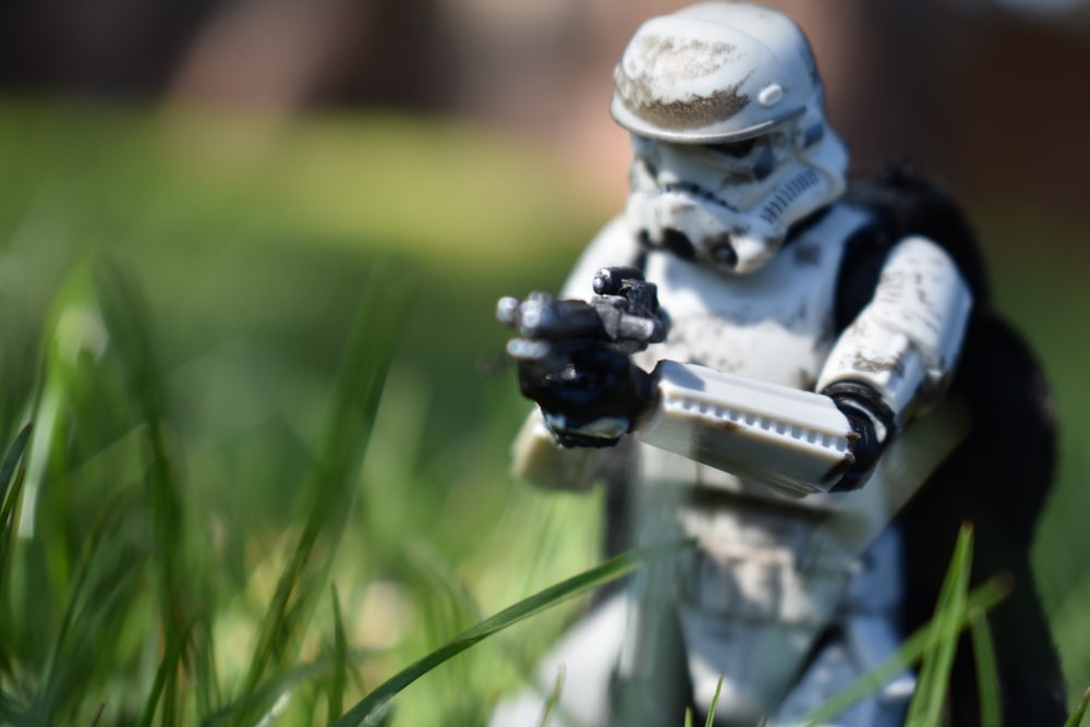 a toy figurine of a storm trooper holding a gun