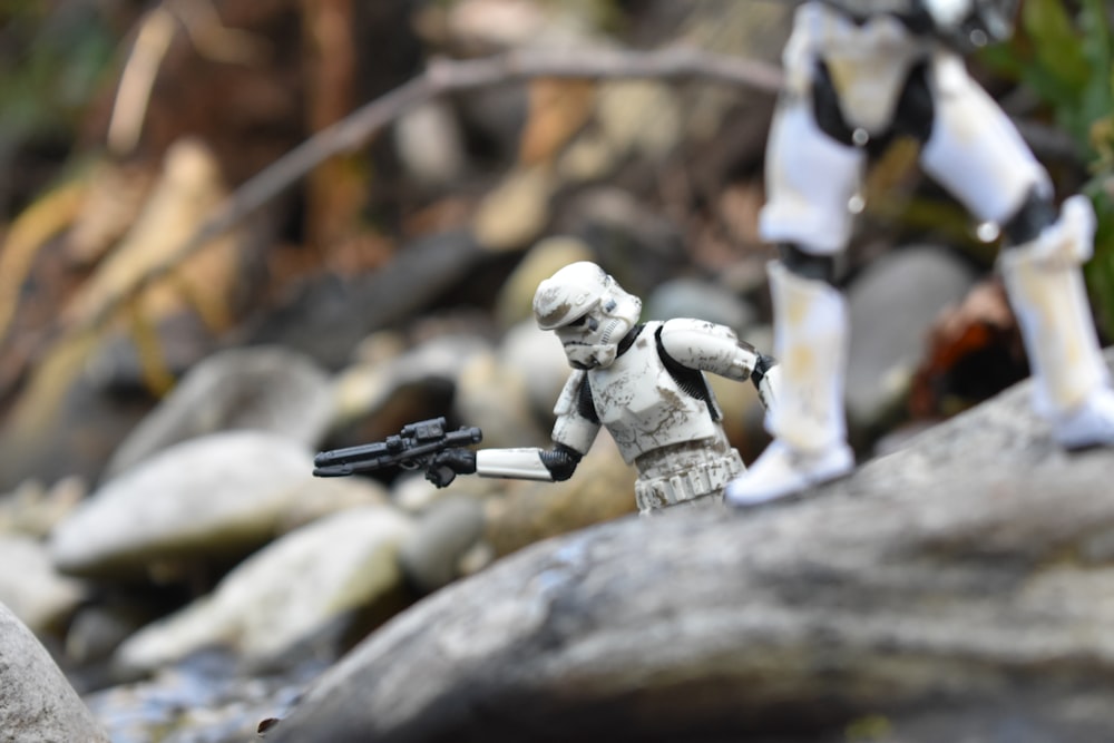 a star wars action figure holding a gun