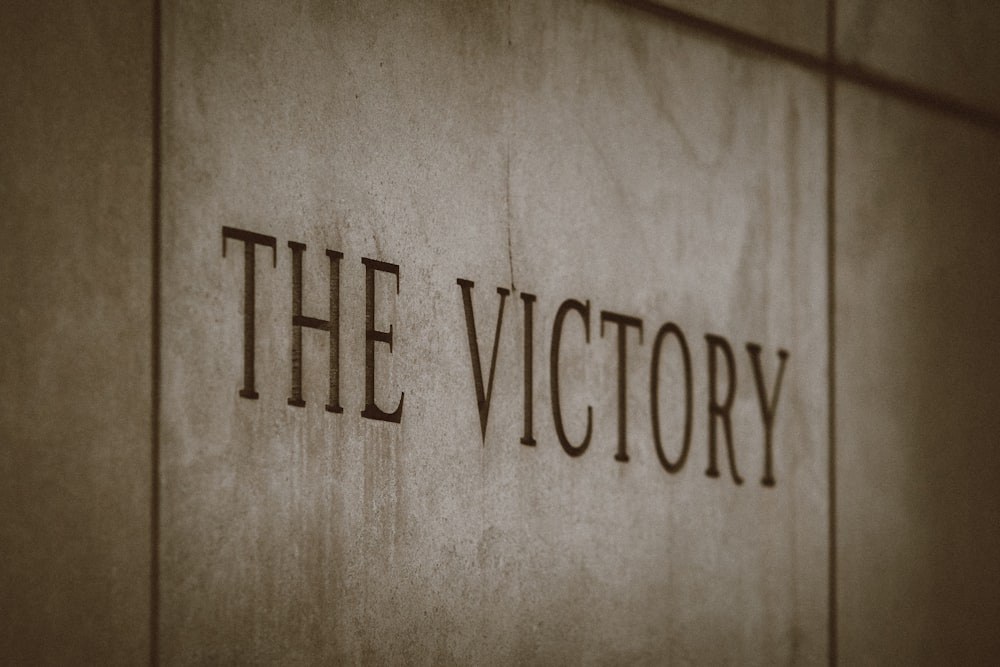 the victory sign on the side of a building