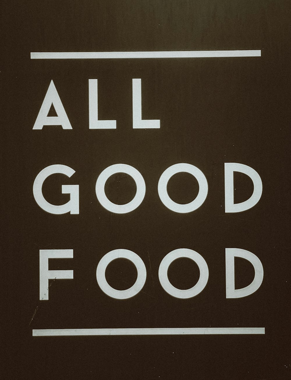 a close up of a street sign with the words all good food
