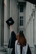 a woman in a graduation cap and gown