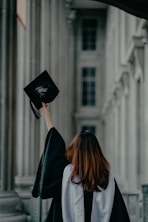 a woman in a graduation cap and gown