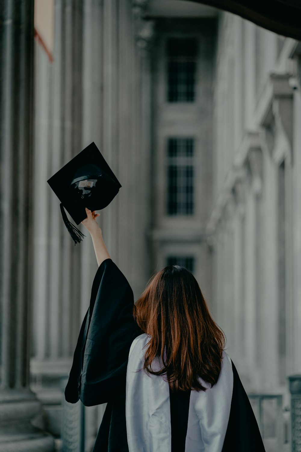 a woman in a graduation cap and gown