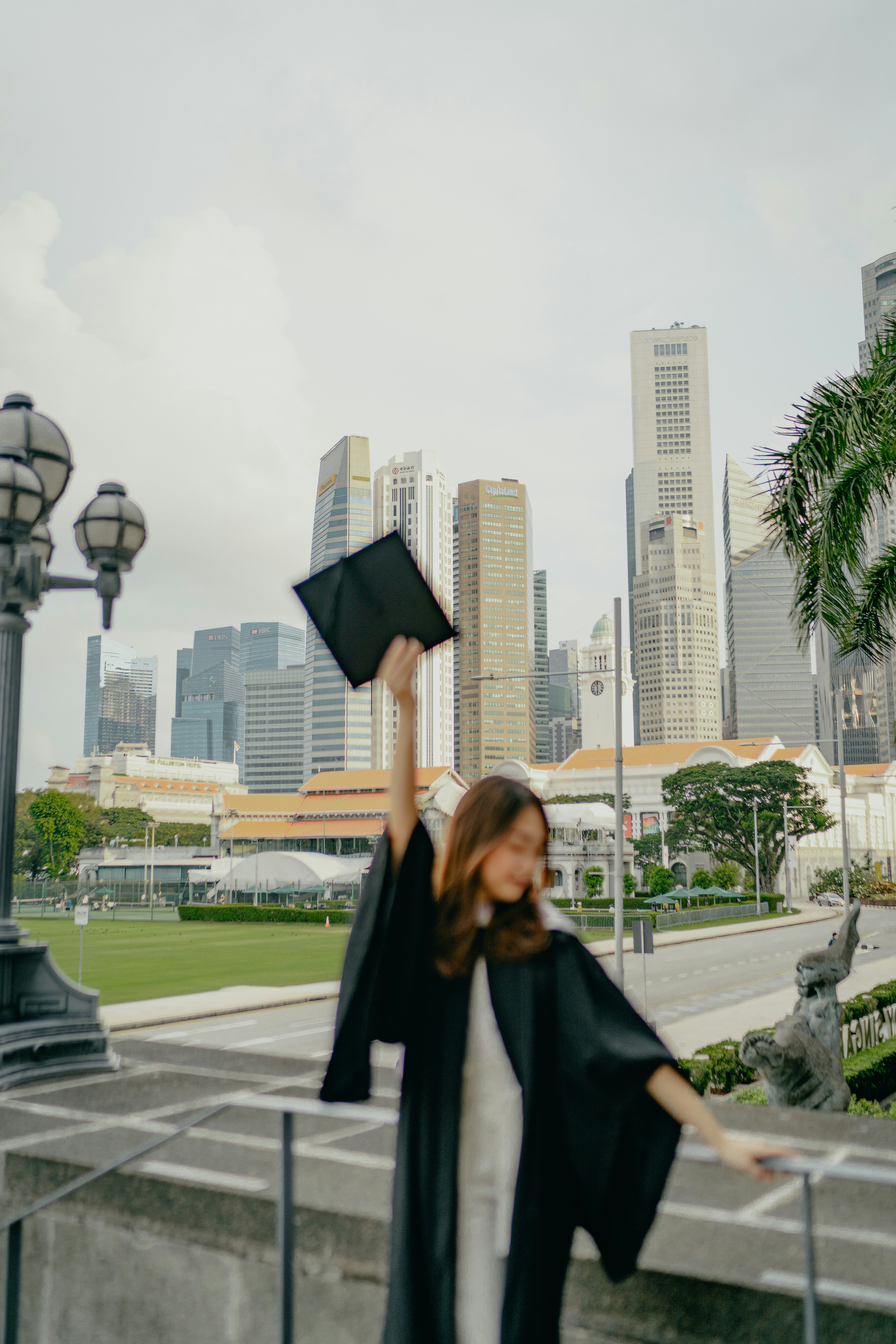 a woman with a graduation cap and gown