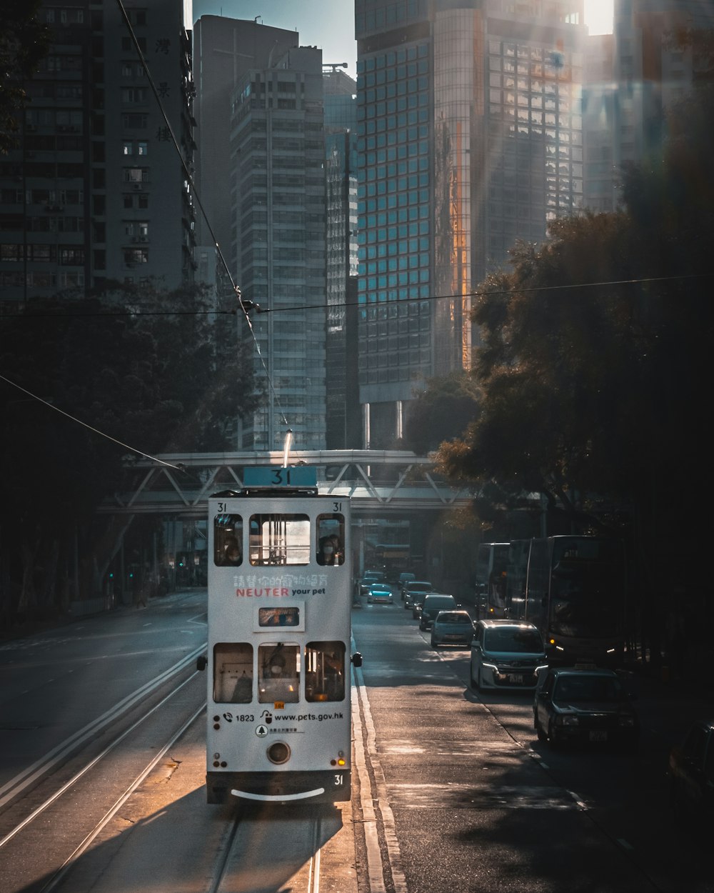 a double decker bus driving down a city street