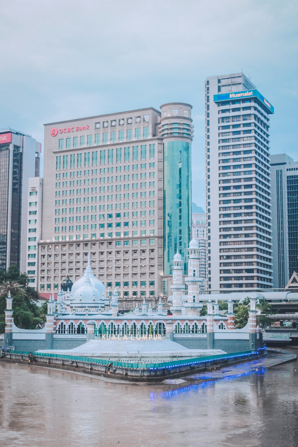 a large body of water in front of tall buildings