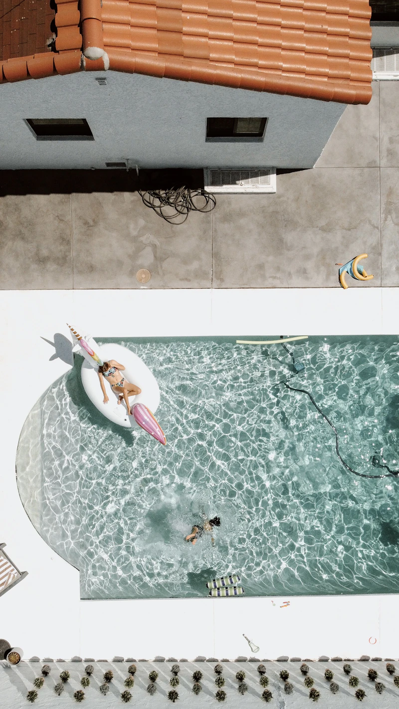 Backyard pool being enjoyed on a sunny Scottsdale afternoon