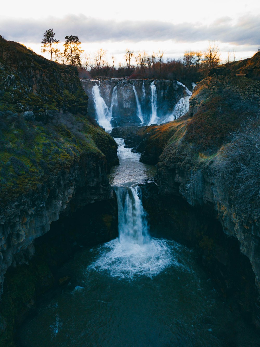 a waterfall with water coming out of it