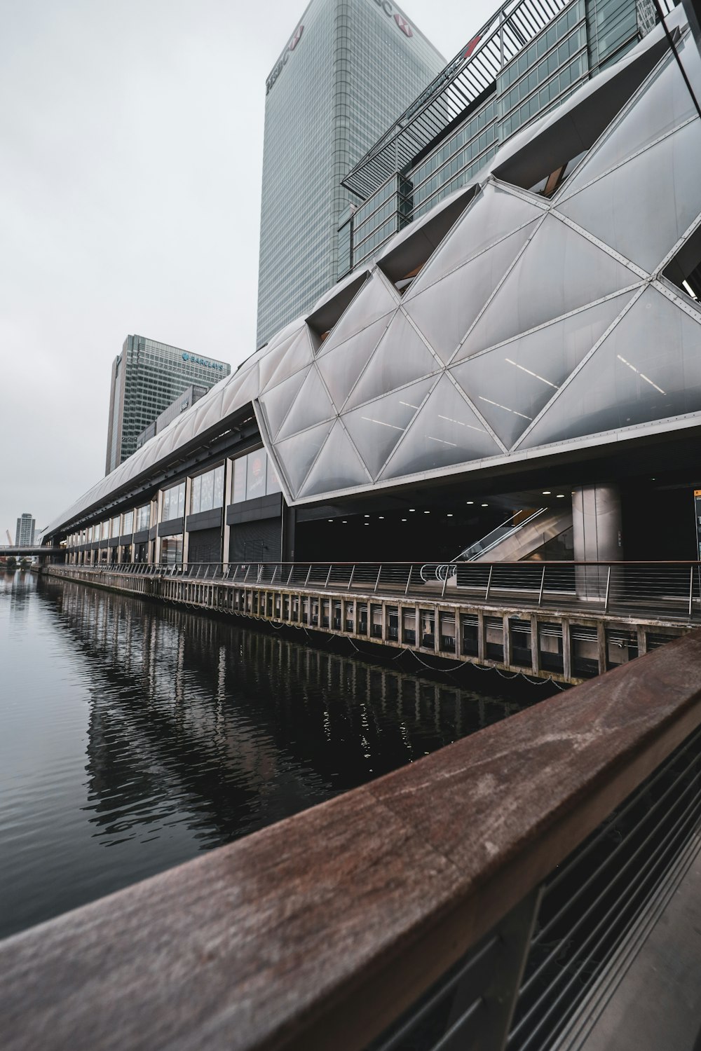 a large building sitting next to a body of water