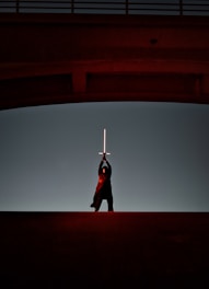a man that is standing in the dark