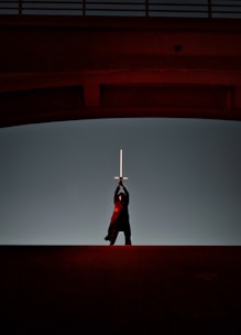 a man that is standing in the dark