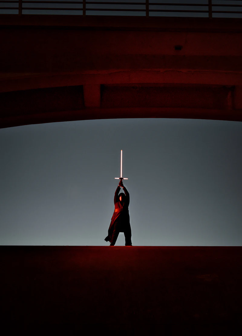 Glowing lightsaber against dark background