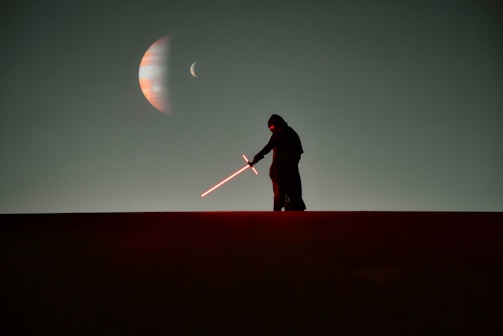 A close-up of Earthling Vmax wielding a blazing sword under a dark sky.