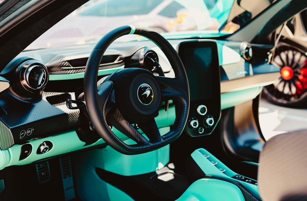 a close up of a car dashboard with a steering wheel