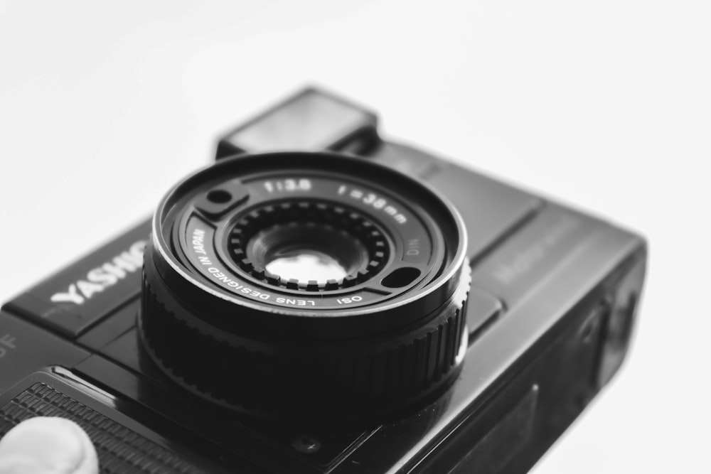 black camera lens on black surface