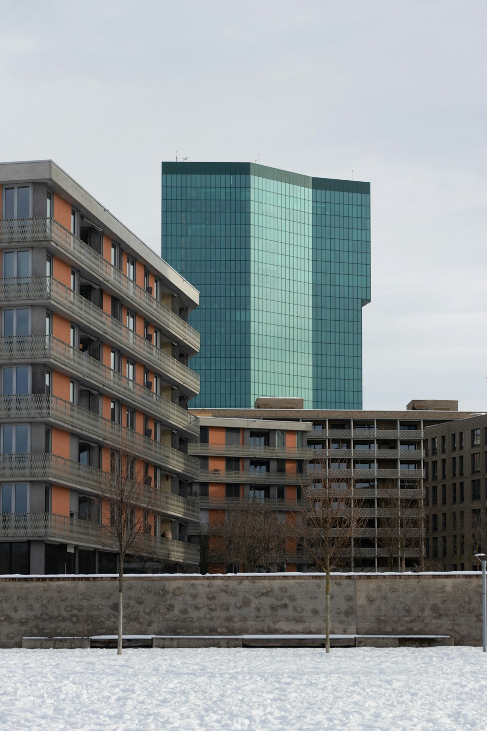 brown and white concrete building under white sky during daytime