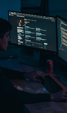 man in black long sleeve shirt using computer