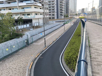 A corner plot with wide road access and modern street lighting.