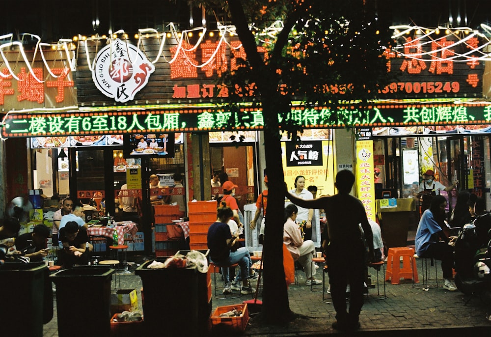 people walking on street during night time