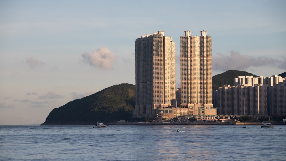 a large body of water with a city in the background