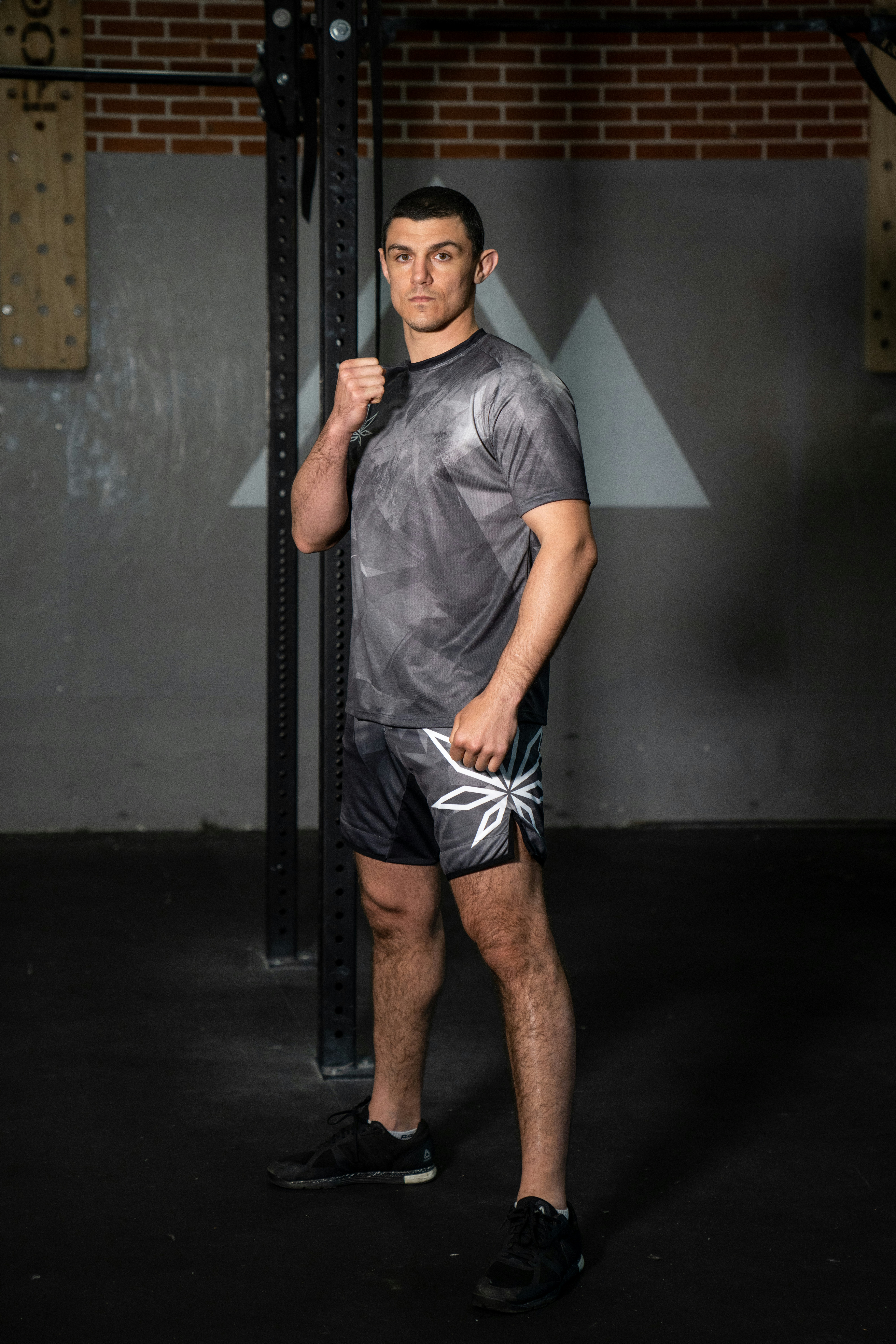 Jordan Ellis, athletic person with confident expression, gym background