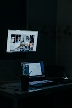 a laptop computer sitting on top of a desk