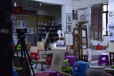Friendly instructor guiding students in a creative workshop at the academy.