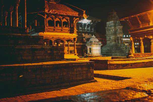 A refined cultural experience with traditional dancers and artisans, framed by intricately carved temple architecture under warm lighting.