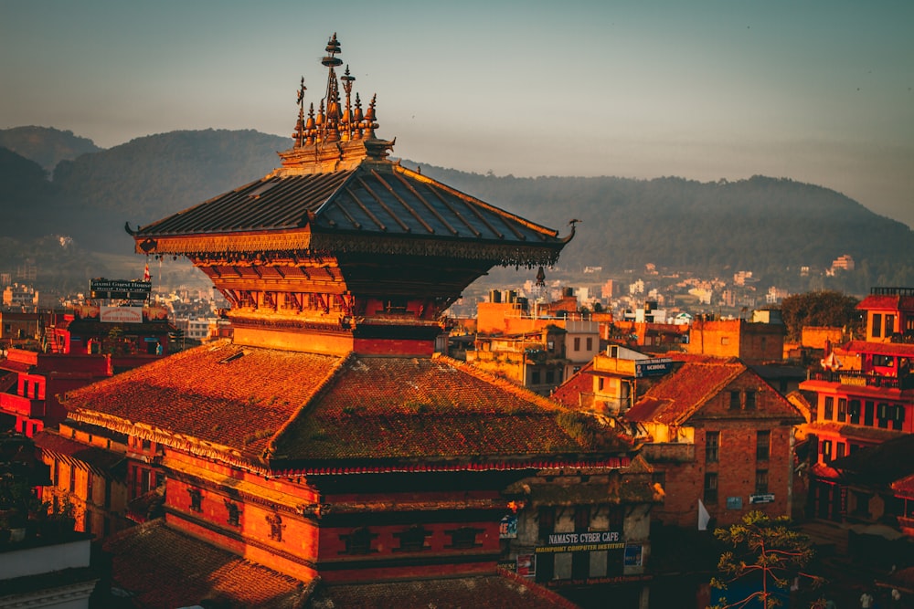 a view of a city with mountains in the background