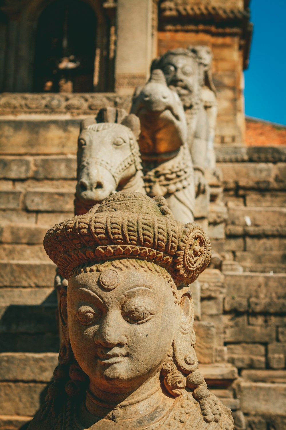 a statue of a woman with a hat on her head