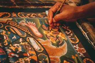 Final touches being added to a detailed artwork.