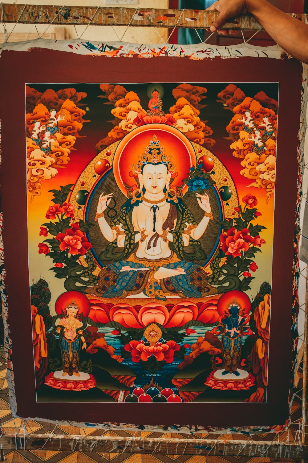 a painting of a buddha sitting in a meditation position