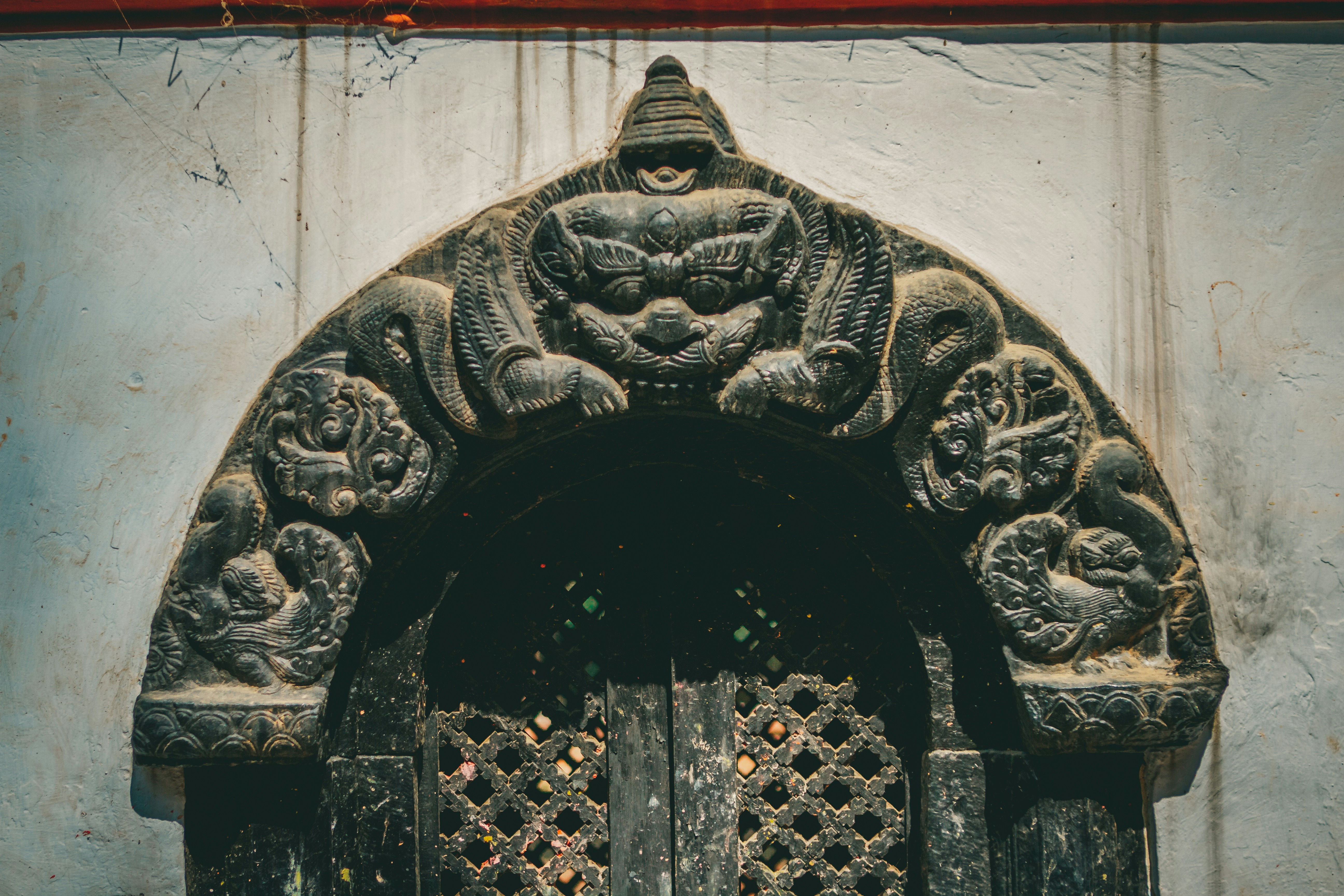 a door with carvings on the outside of it