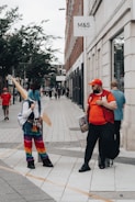 a couple of people that are standing in the street
