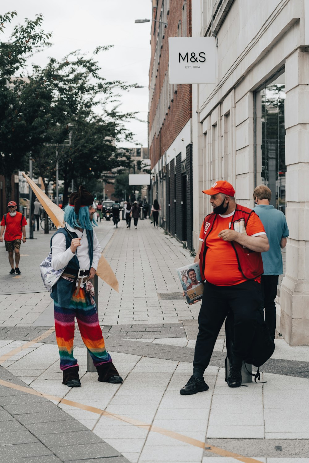 a couple of people that are standing in the street