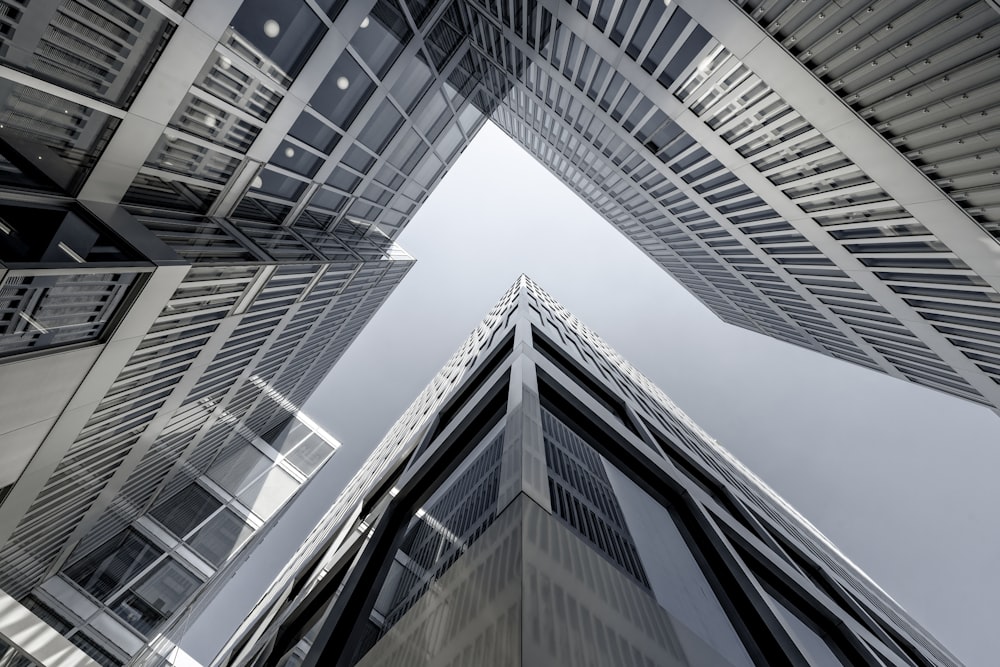 looking up at tall buildings in a city