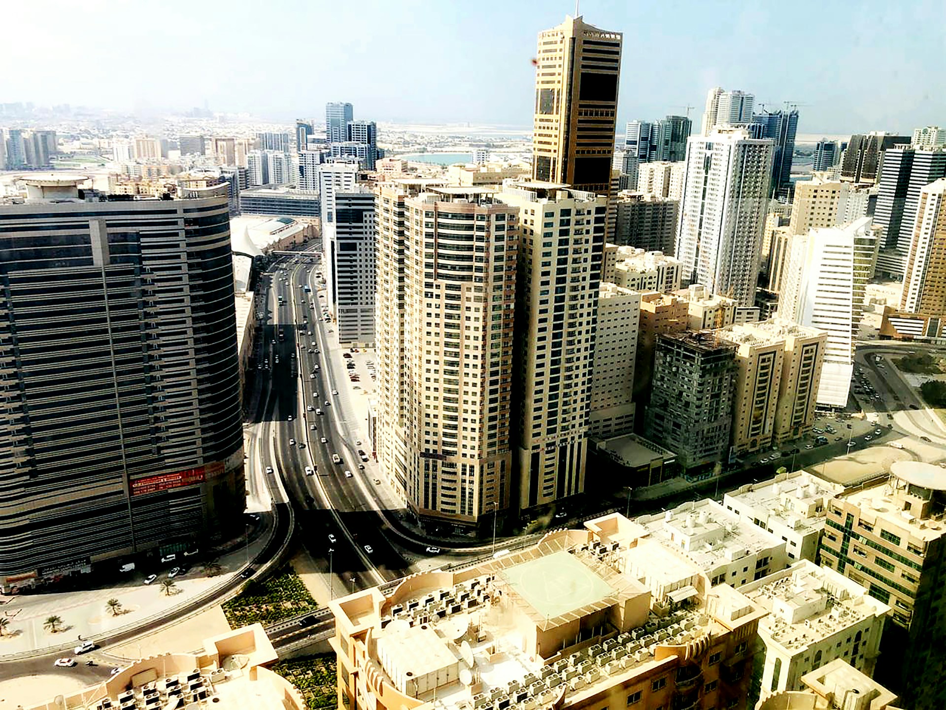woman wearing yellow long-sleeved dress under white clouds and blue sky during daytime