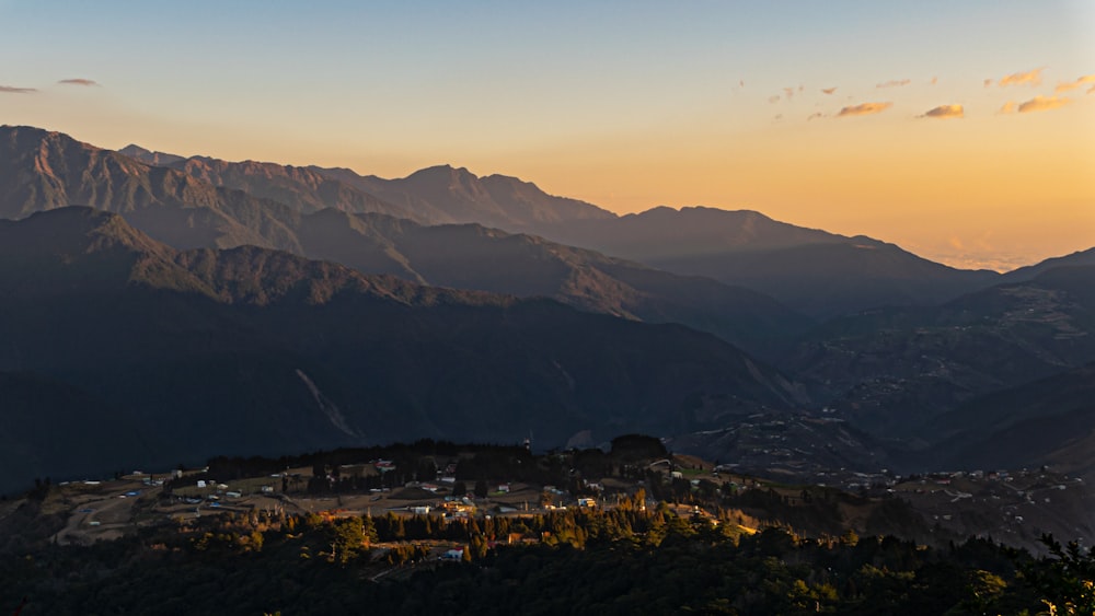 aerial view of city near mountains during daytime