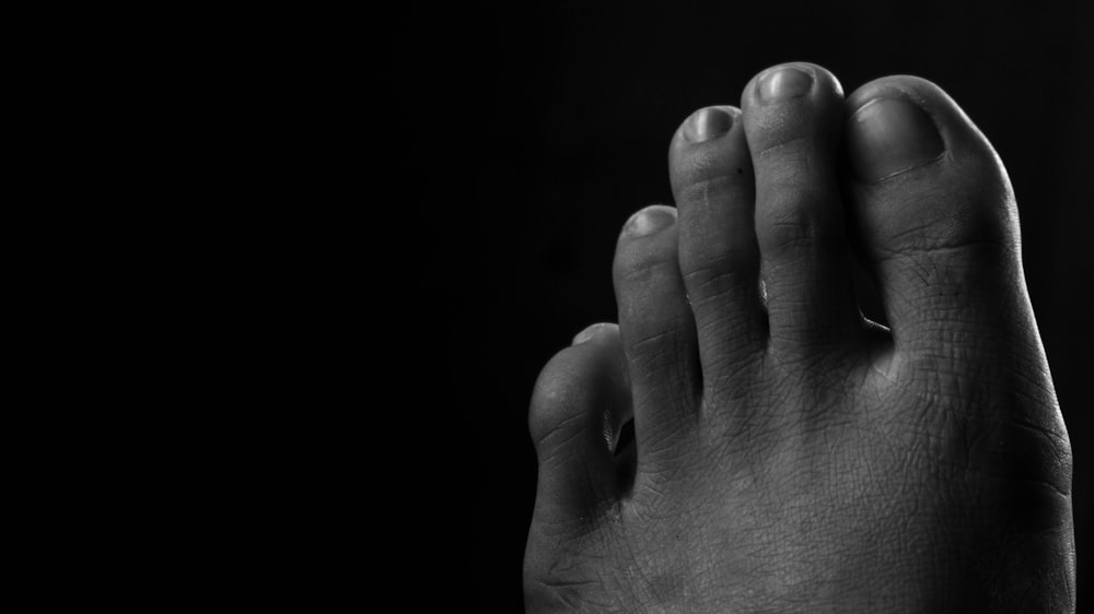 grayscale photo of persons feet