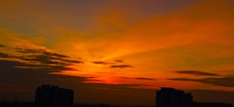 A vibrant sunset over the Rio Vermelho neighborhood in Salvador, with colorful buildings and lively streets.