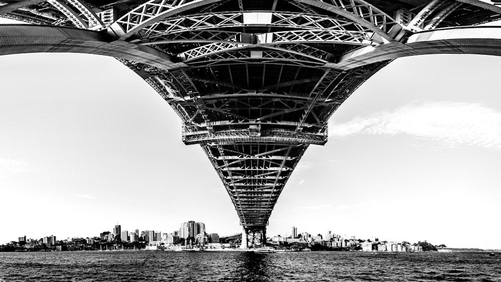 a black and white photo of the underside of a bridge